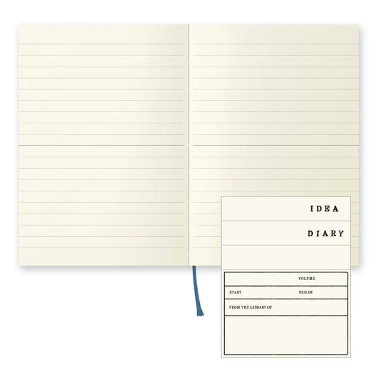 MD notebook open showing lined pages and lay-flat spiral binding