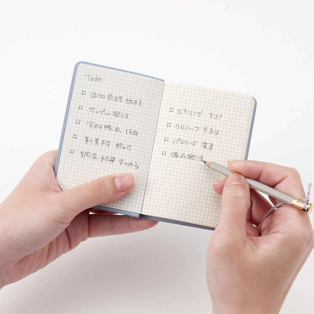 Isshoni. Pocket Notebook - Grid