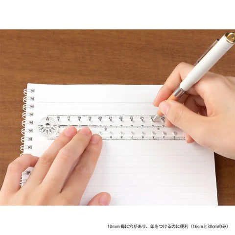 Midori ruler in use on journal spread for drawing straight lines