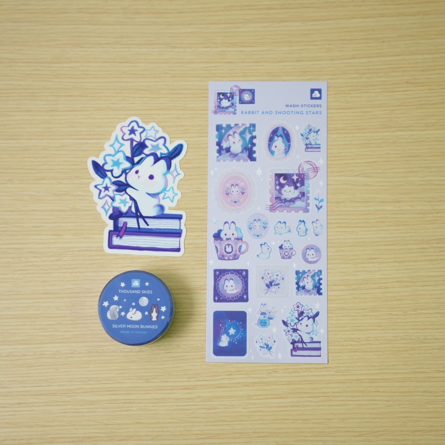 Thousand Skies Celestial Rabbit Bundle — washi tape, washi sticker sheet, and vinyl sticker flat lay on wood background