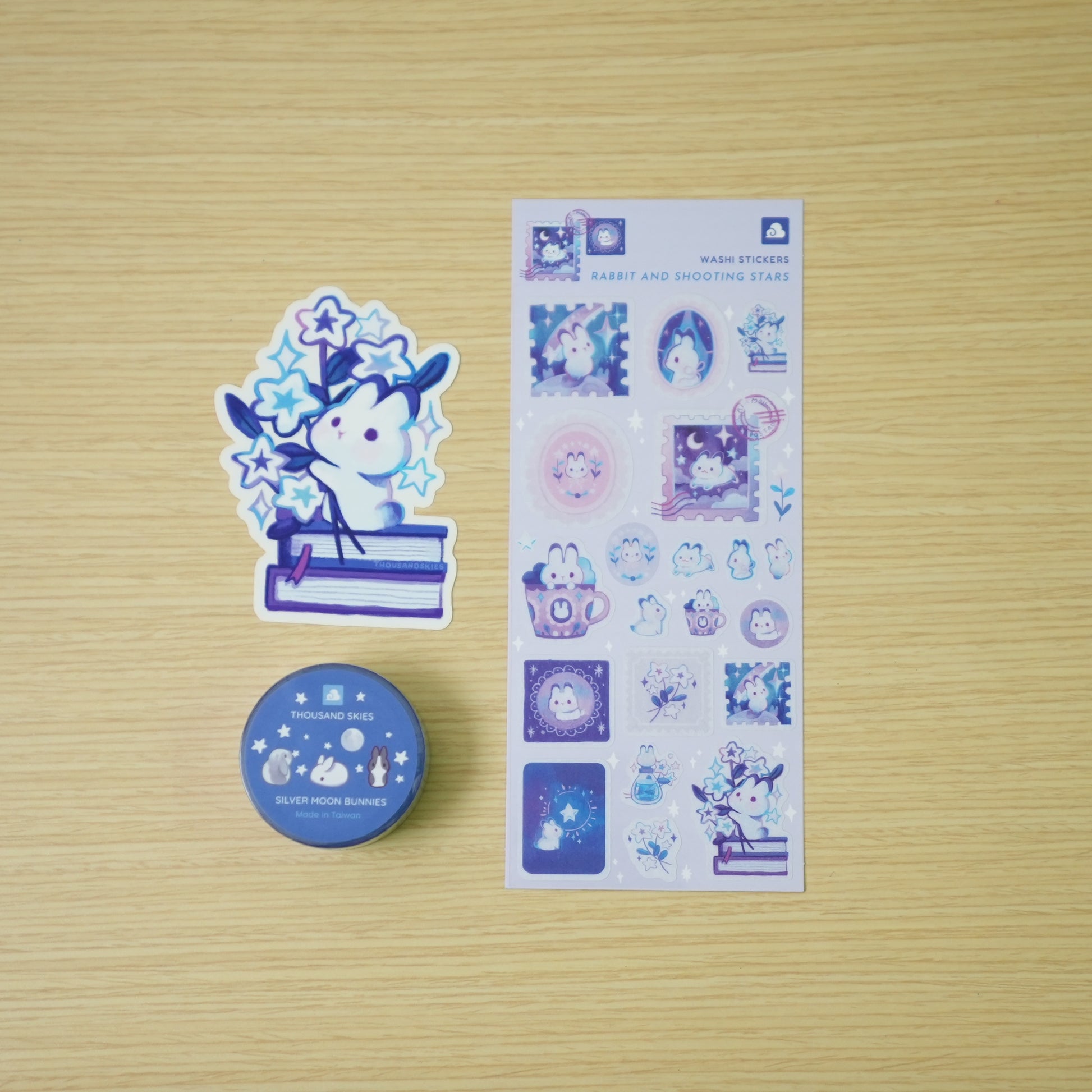 Thousand Skies Celestial Rabbit Bundle — washi tape, washi sticker sheet, and vinyl sticker flat lay on wood background