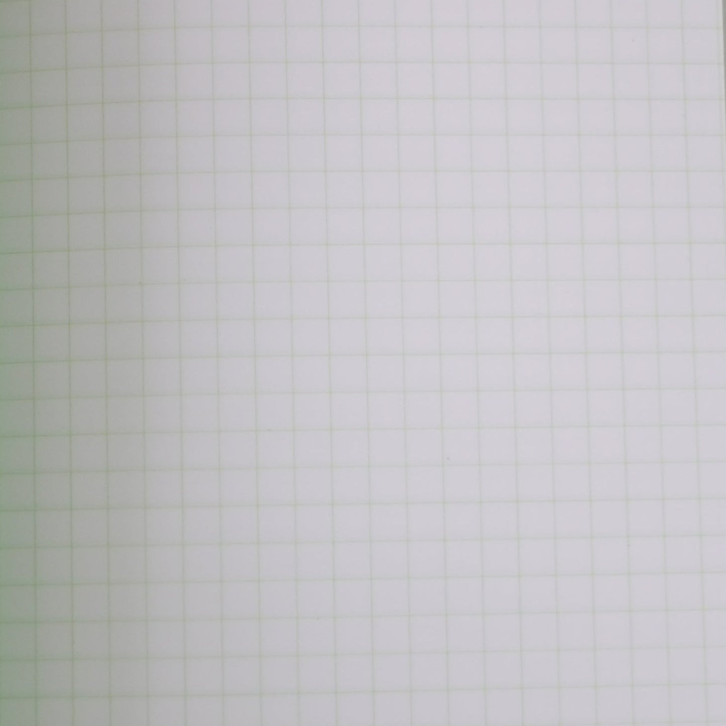 open pistachio life notebook with green grid