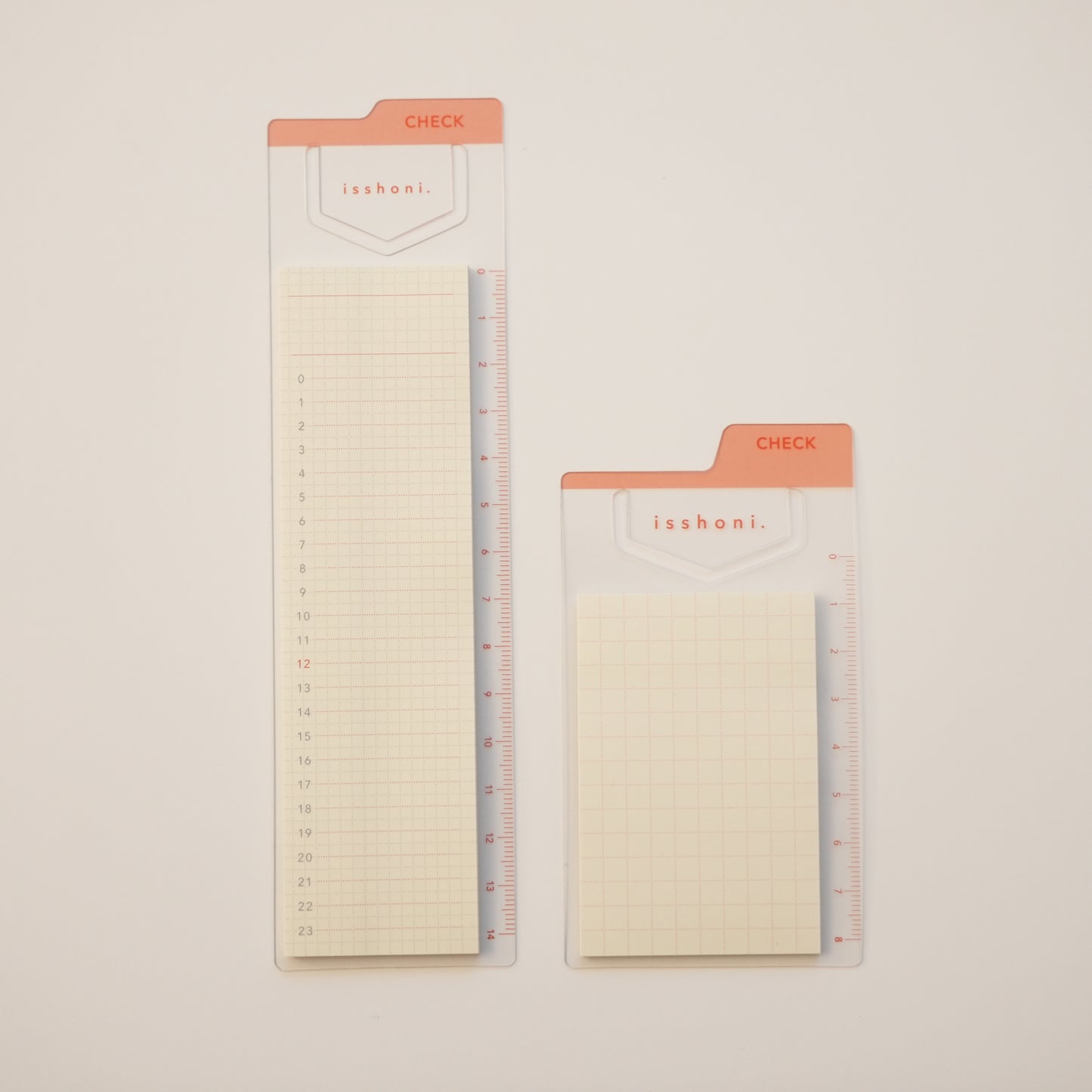 Isshoni. Bookmark Index Sticky Notes. One mini with a red grid, one regular sized with a daily schedule. Both mounted on red ruler bookmarks. 