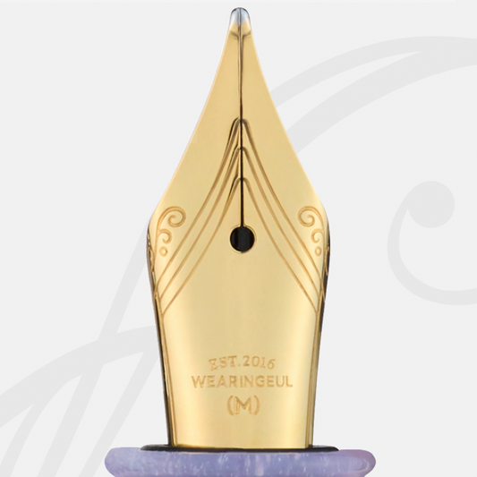 Gold fountain pen nib "A Dream Within a Dream" with 'Wearingeul' branding on a light white background