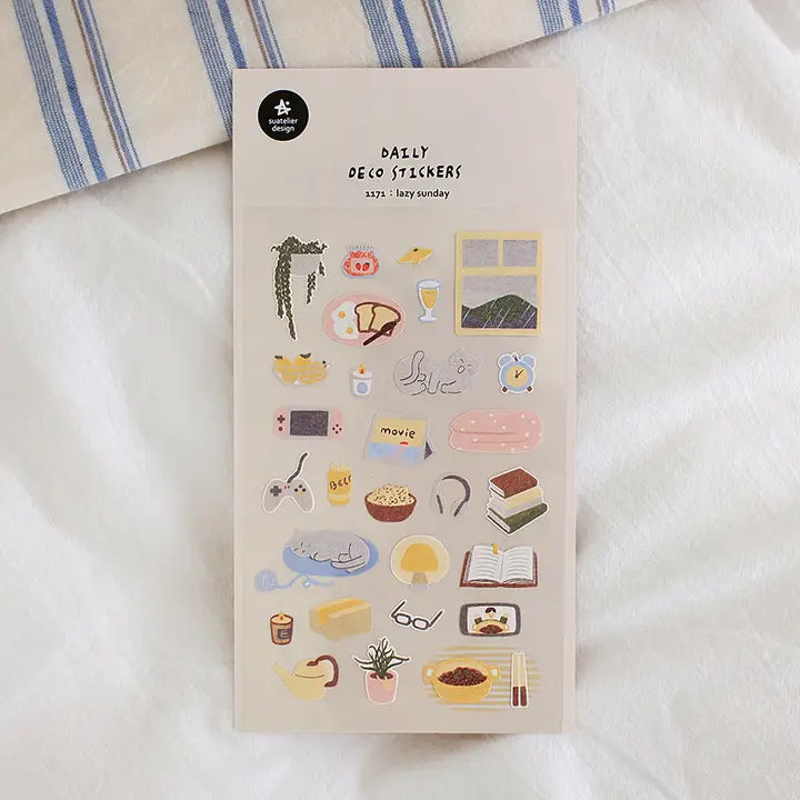 Suatelier No.1171 Lazy Sunday is a sticker sheet packed with everything you'd want from a lazy Sunday at home: eggs and toast, hanging plant, books, mushroom lamps, food, tea, candles, snacks, cats, movies, ipads, nintendo switches, rice, phone