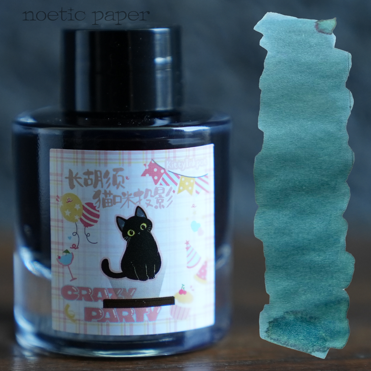 Kitty Inkpot long whiskered cat projection on a desk with a swatch next to it. 