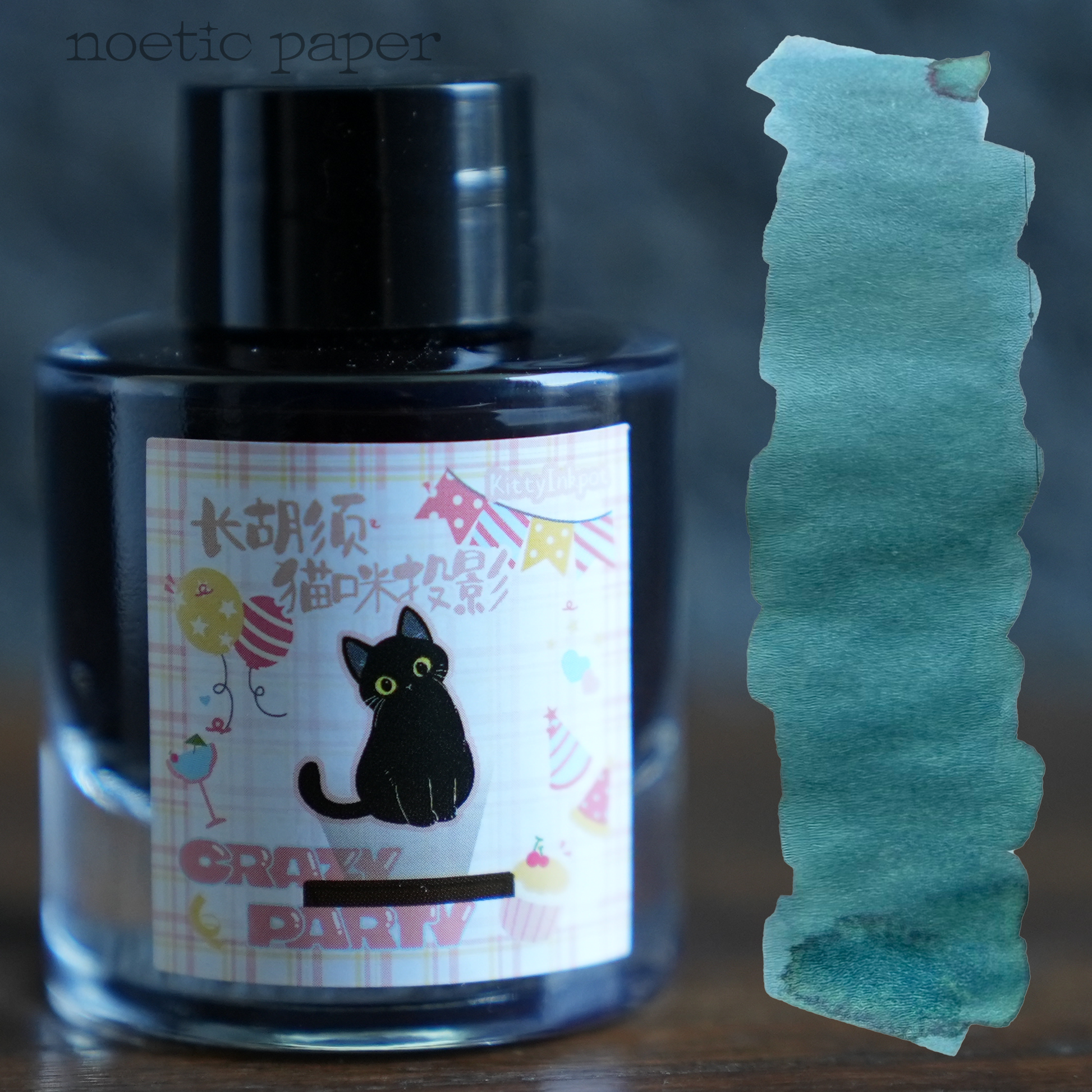 Kitty Inkpot long whiskered cat projection on a desk with a swatch next to it. 