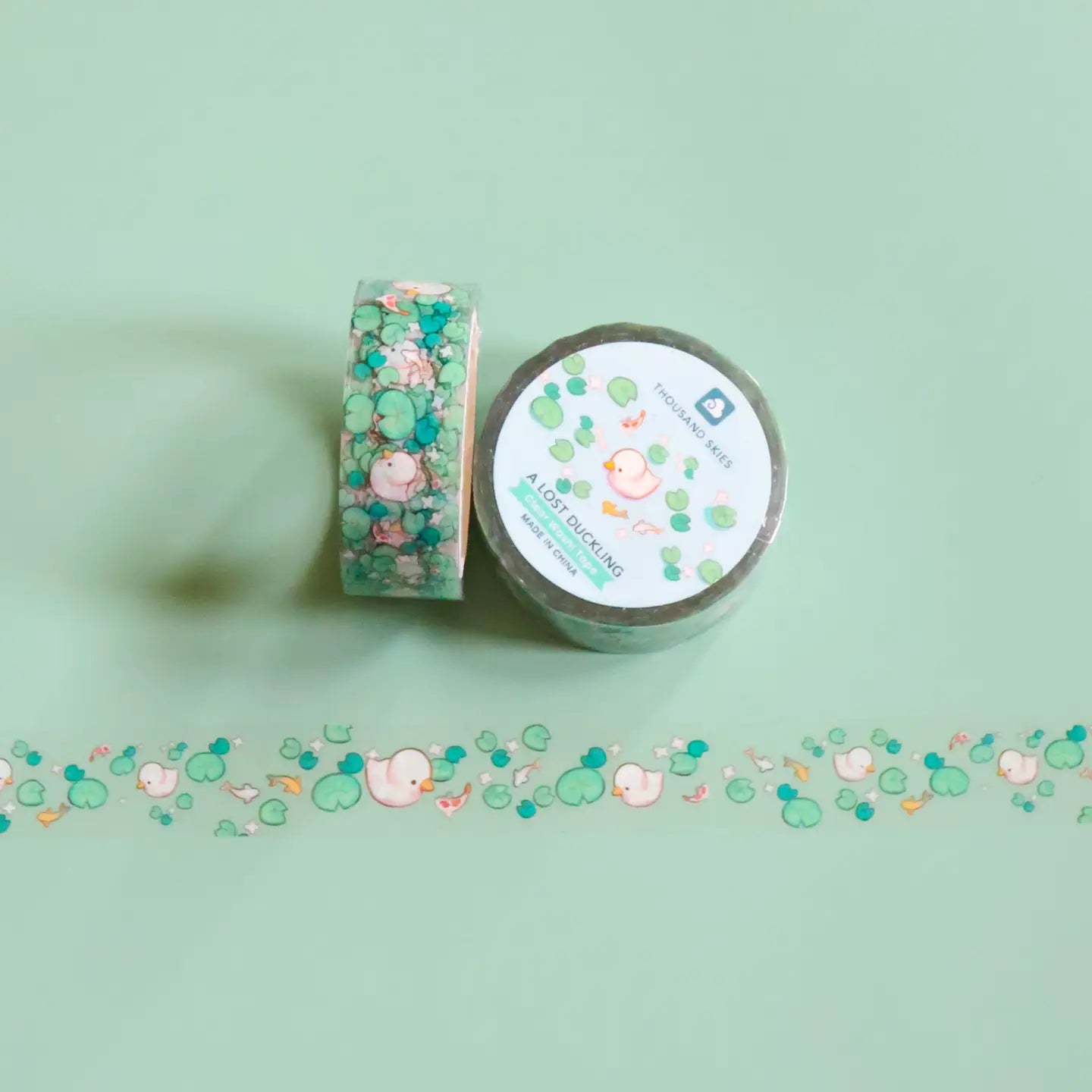 Close-up of A Lost Duckling clear tape layered over solid spread showing transparency
